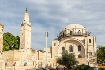 Fototapeta na wymiar The Hurva Synagogue and the Caliph Omar mosque in the Jewish Quarter in the old city of Jerusalem, Israel