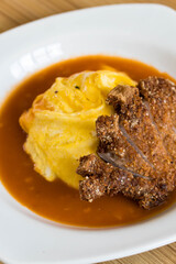 delicious fried pork chop in Japanese rice omelets also known as Omurice