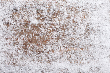 Snow on vintage wooden desk top view