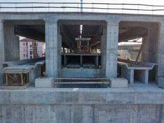 Aerial drone view. Construction of the metro level across the bridge.