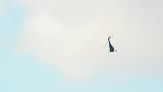 Flying helicopters in the sky.