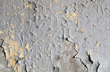 Old painted wall, peeling paint texture.
