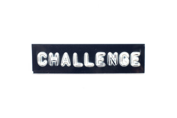 Embossed letter in word challenge on black banner with white background