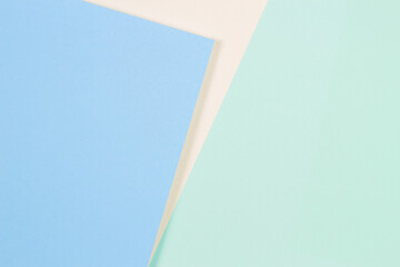 Abstract colored paper texture background. Minimal geometric shapes and lines in light blue, green, pastel yellow colors