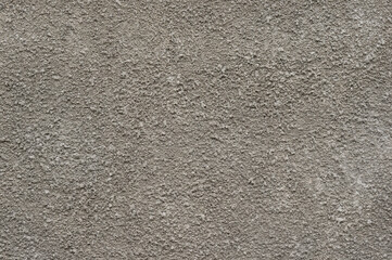 Texture of gray cement plaster on the wall