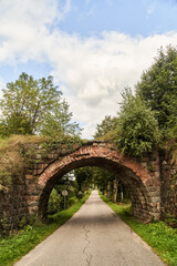 Old German bridge across the road. The bridge of the Rominten Forest. Vishtynetskoe lake. Kaliningrad region. 