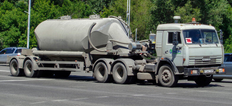 Kazakhstan, Ust-Kamenogorsk, june 22, 2020: Gray truck with trailer. Cistern. KamAZ-54115