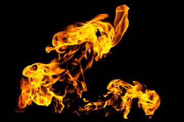 Fototapeta premium Fire flames on black background isolated. Burning gas or gasoline burns with fire and flames. Flaming burning sparks close-up, fire patterns. Infernal glow of fire in the dark with copy-space