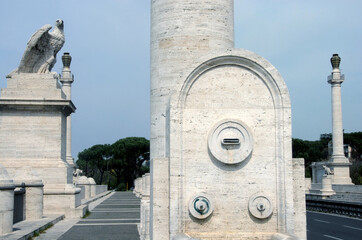 Ponte Flaminio is a bridge over the Tiber in rationalist architecture adorned with sculptures and travertine columns.