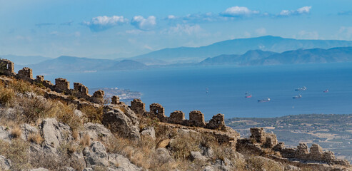 Fascinating ruins of the .Acrocorinth (Upper Corinth), the acropolis of ancient Corinth, overseeing the ancient city of Corinth