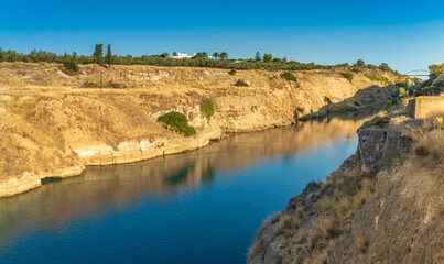 Fototapeta na wymiar The stunning Corinth Canal connecting the Gulf of Corinth in the Ionian Sea with the Saronic Gulf in the Aegean Sea.