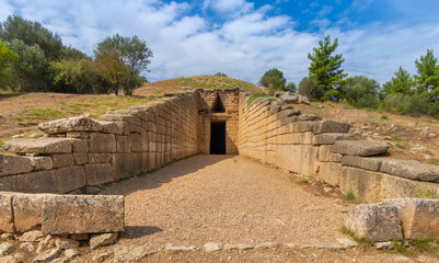 Fototapeta na wymiar Imposing ruins of the tomb of Agamennon in Mycenae, an archaeological site near Mykines in Argolis, north-eastern Peloponnese, Greece.