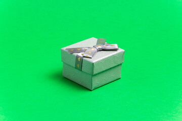 gift box with ribbon. on a green background