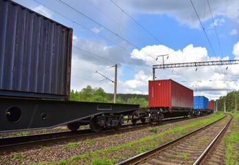 Fototapeta na wymiar Cargo Containers Transportation On Freight Train By Railway. Intermodal Container On Train Car. Rail Freight Shipping Logistics Concept. Import - export goods from Сhina.