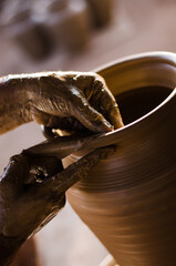 close up of potters hand, pottery