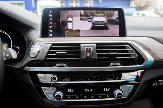 Moscow, Russia - November 7, 2019: Display in interior of luxury car shows working of four cameras in surround view assist system. 360 degrees Image display on the head unit. Multimedia in the car.