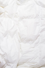 Top view of bedding sheets crease, white blanket texture. Close up of bedding sheets with copy-space