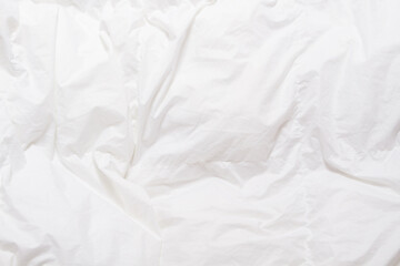Top view of bedding sheets crease, white blanket texture. Close up of bedding sheets with copy-space
