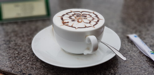 cup of cappuccino with chocolate