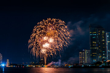 Firework display for celebration happy new year and merry christmas with Twilight night and firework lighting in bangkok cityscape, Thailand.