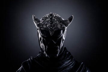 Demon with horned helmet in the dark