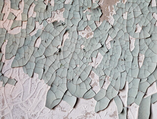 Old painted wall, peeling paint texture.
