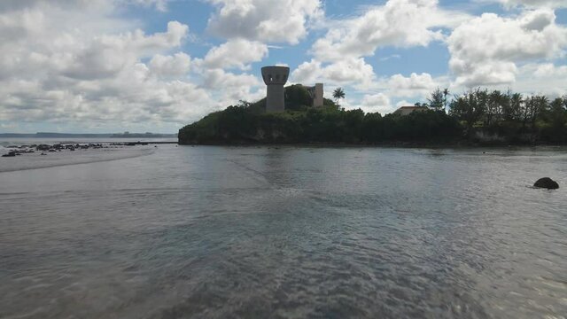 Drone flying up and over the Latte of Freedom in Guam USA