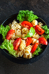 pasta salad tomato vegetables lettuce healthy gluten free ingredient vitamins snack top view copy space for text food background rustic