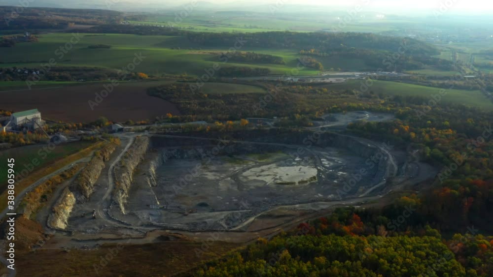 Wall mural Camera flight over a open cast mine. Industrial landscape. Heavy industry from above.  - Wall murals