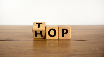 Turned a cube and changed the word 'Pay' to 'Day'. Beautiful wooden table. White background. Business concept.