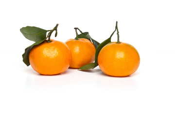 Fototapeta na wymiar Citrus Ripe orange tangerine with green leaves isolated on a white background organic food