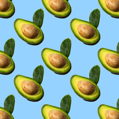 Seamless pattern of half avocado with stone and leaf, shadow, blue background. Healthy vegetarian food, background for design.