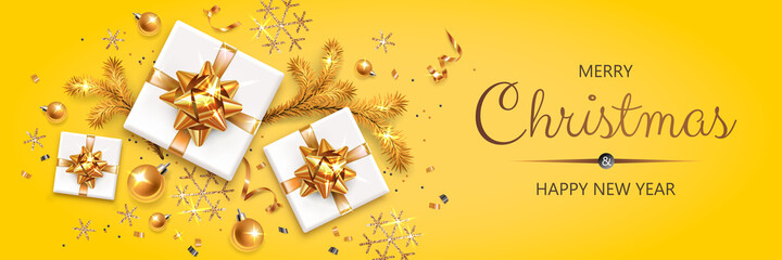 Obraz na płótnie Canvas Horizontal banner with gold Christmas symbols and text. Christmas tree, gifts, serpentine and snowflakes on yellow background.