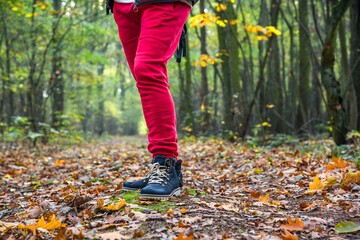 Blue boots on yellow leaves , Woman in leather boots