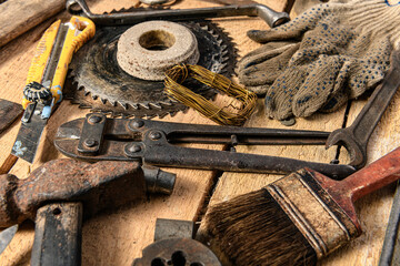 Old vintage household hand tools still life on a wooden background in a DIY and repair concept