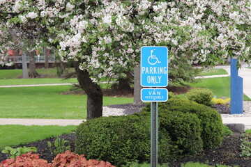 Road sign on the background of urban greenery
