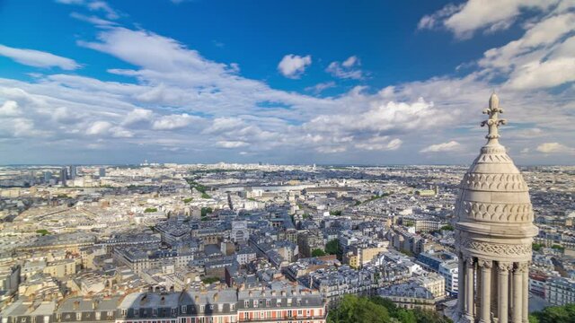 Panorama of Paris aerial timelapse, France. Top view from Sacred Heart Basilica of Montmartre (Sacre-Coeur). Sunny day with blue cloudy sky.