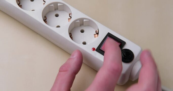 Turns on and off a surge protector for multiple outlets.