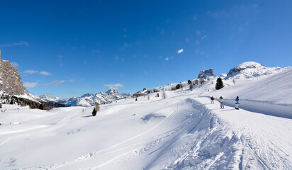 Fototapeta na wymiar skiers on the snowy slopes