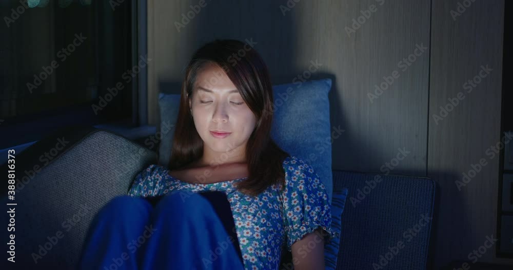 Wall mural woman use of digital tablet at night