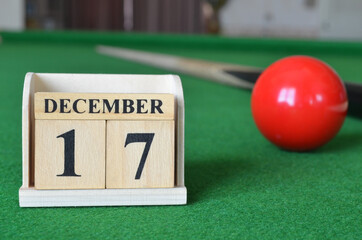 December 17, number cube with balls on snooker table, sport background.
