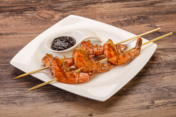 Grilled prawn skewer with pepper sauce
