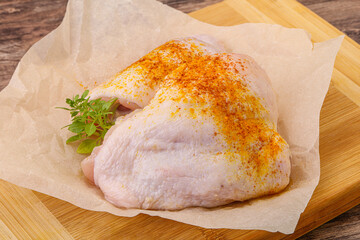 Raw chicken thigh with spices