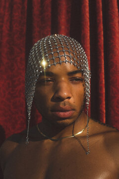 Close Up Portrait Of Black Man Wearing Jewels On Head