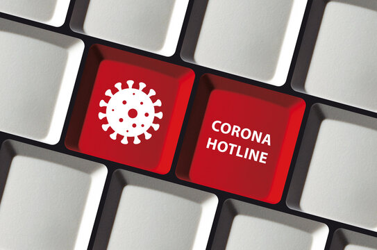 Corona Covid-19 hotline text and virus icon on computer keyboard on red keys