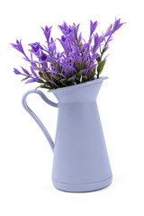 Artificial purple flowers in decorative plastic vase