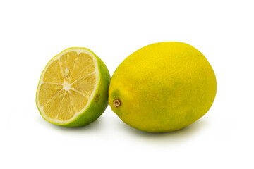 Whole and half lemons on isolated white background