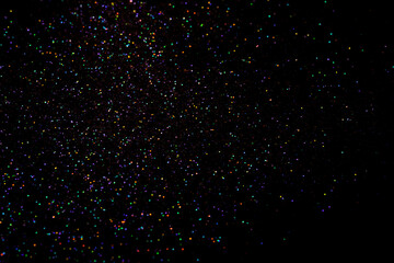 glitter sparkle powder background isolated on black background, star glitters background