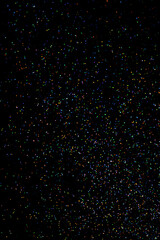 glitter sparkle powder background isolated on black background, star glitters background