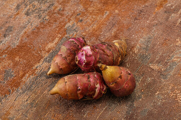 Raw topinambur root or Jerusalem artichoke